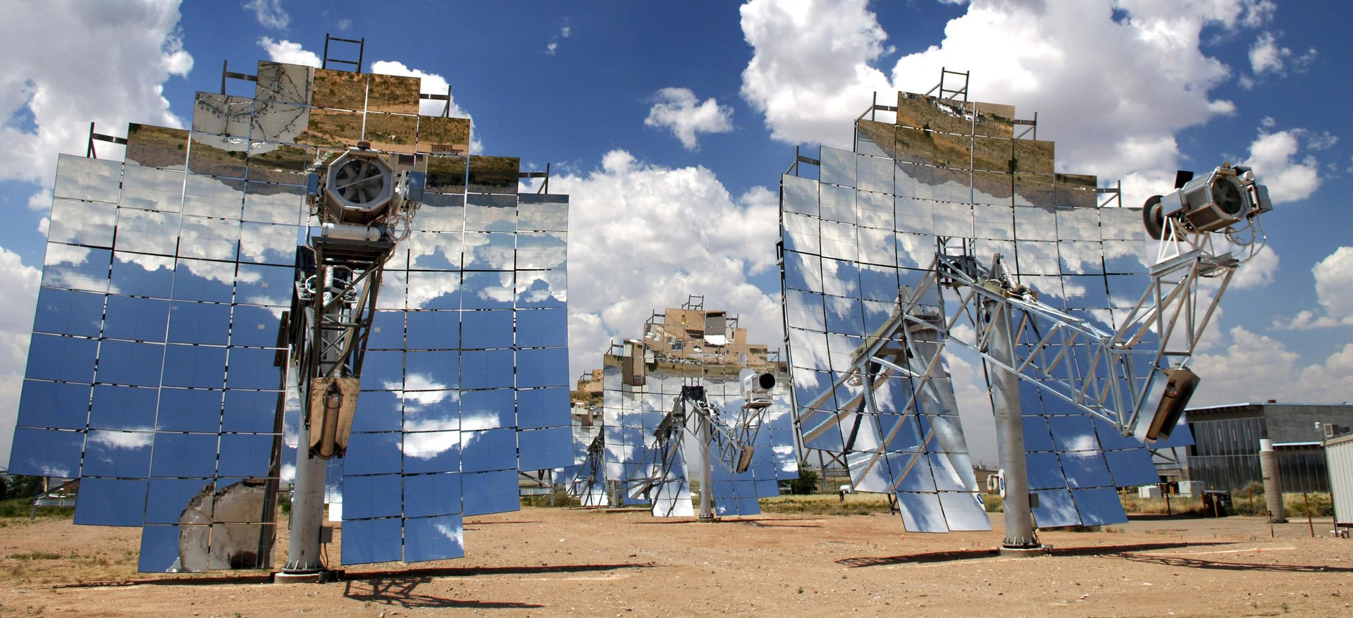 Solar panel installations in the desert under a blue sky